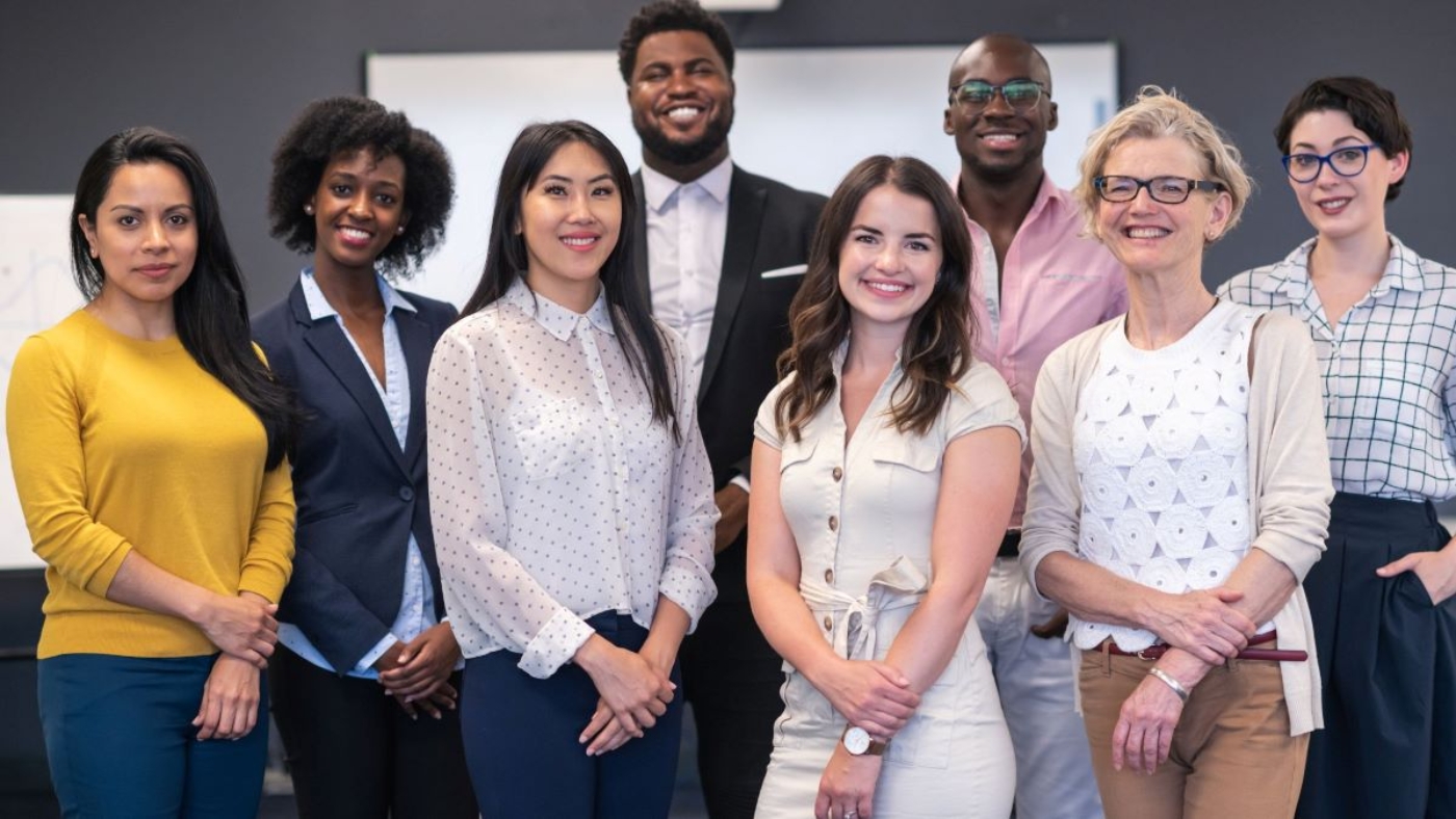 Employees smiling for a photo