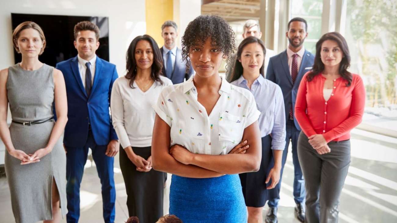 A picture of happy employees standing in a group