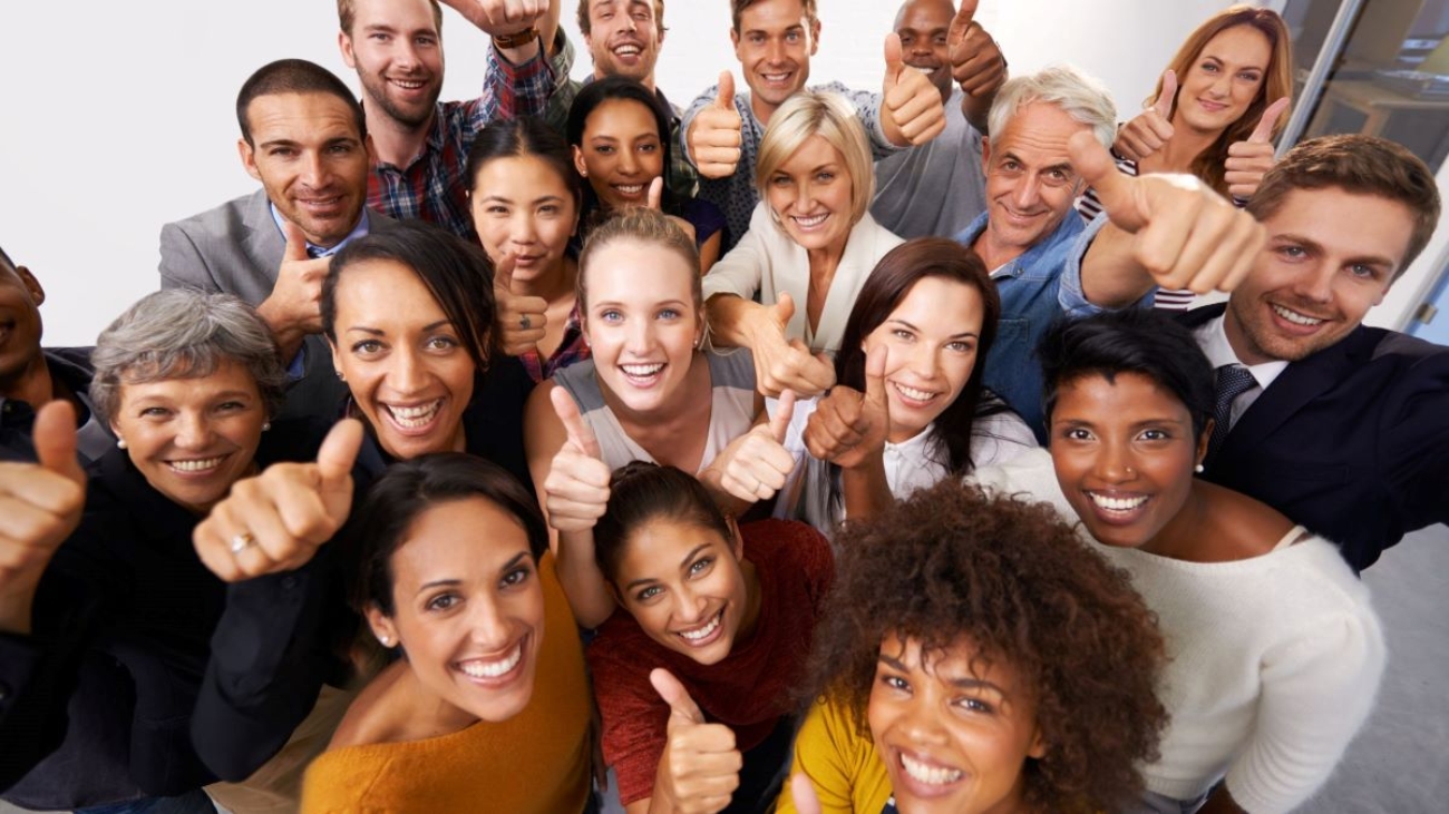 A group of happy employees showing thumbsup